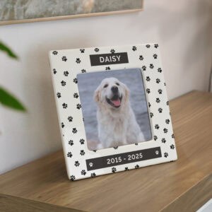 Ceramic paw print photo frame for dog memorial, personalised with pet's name and years.