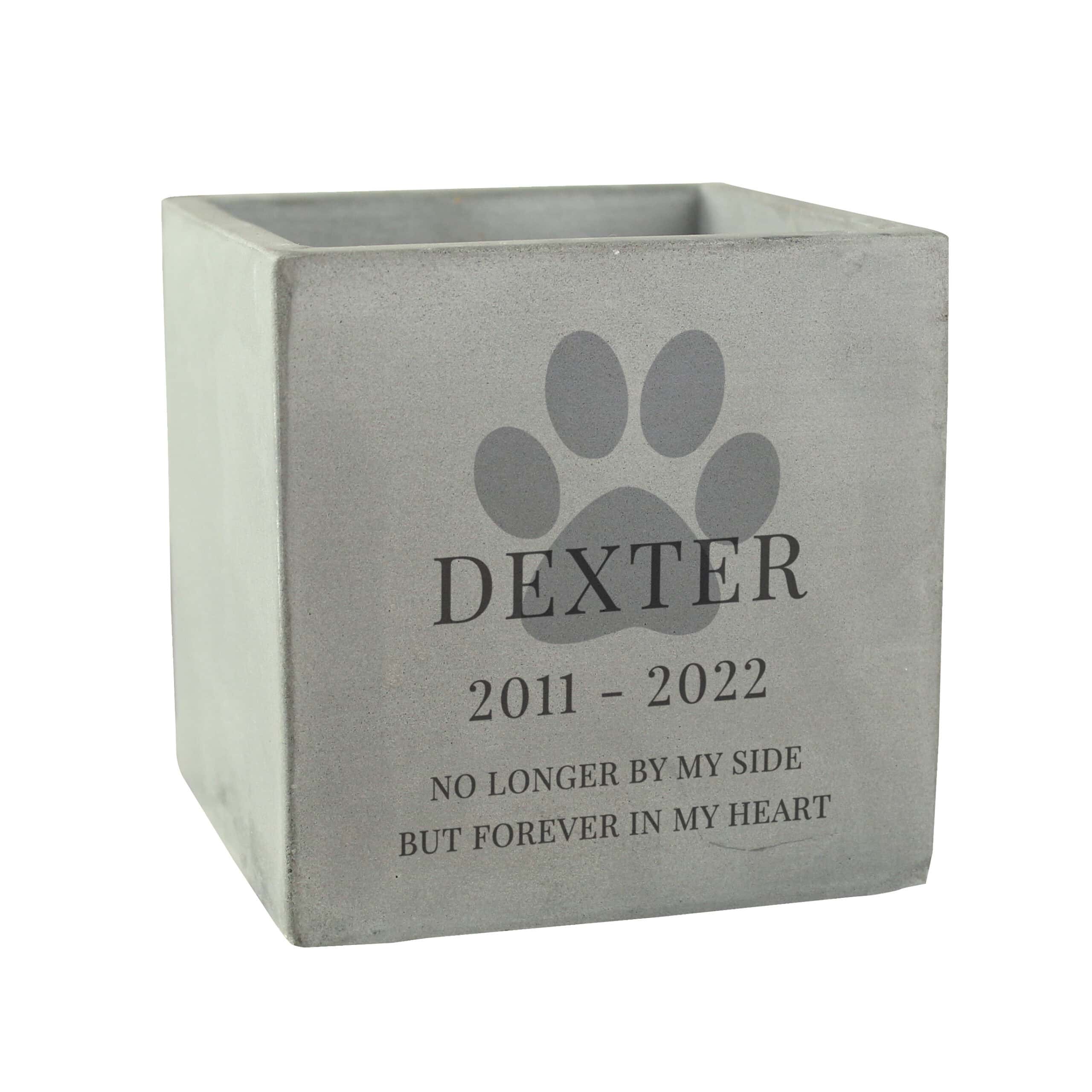 Concrete dog memorial pot with personalised paw print and inscription.