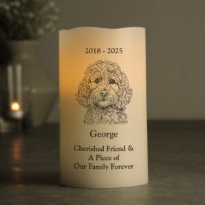 Dog memorial LED candle with engraved portrait and dates.