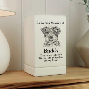 Dog memorial urn with engraved portrait of Buddy, a beloved pet.