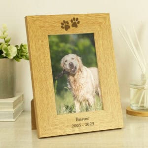 Beautiful oak finish memorial photo frame with paw print design for a beloved dog.