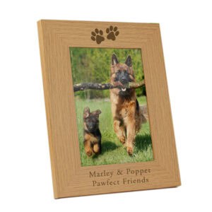 Beautiful personalised oak dog memorial photo frame with paw print design. Perfect for remembering b.