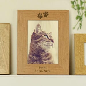 Memorial photo frame with personalised paw print and dates for a beloved pet. Perfect for rememberin.