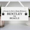 Wooden dog memorial sign with paw print design