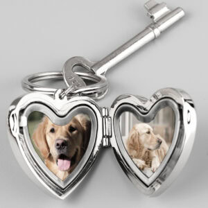 Personalised dog memorial keyring with heart-shaped photo frames and a silver key.
