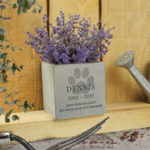 Concrete dog memorial plant pot with paw print design and engraved name