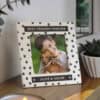 Ceramic 4x4 dog memorial photo frame with paw print design and personalised engraved text