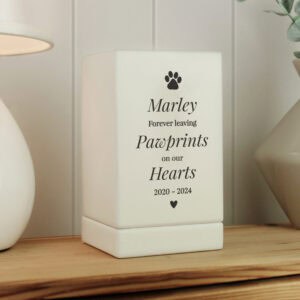 Wooden dog memorial urn with pawprint design and engraved name
